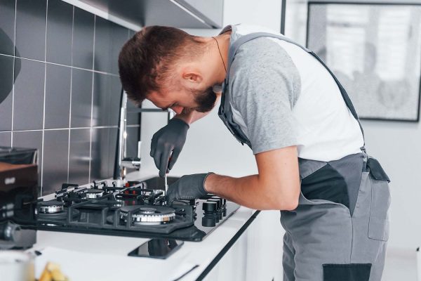 young-professional-plumber-in-grey-uniform-working-resize.jpg young-professional-plumber-in-grey-uniform-working-resize.jpg
